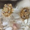 Antique Gold-Plated Floral Stud Earrings with Black Stone Detailing – Traditional Ethnic Design