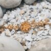 Gold-Plated Chain Bracelet with Delicate Floral Charm – Elegant Ethnic Design